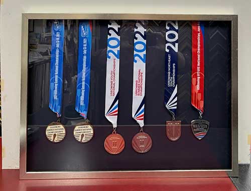 US Rowing medals in a shadowbox