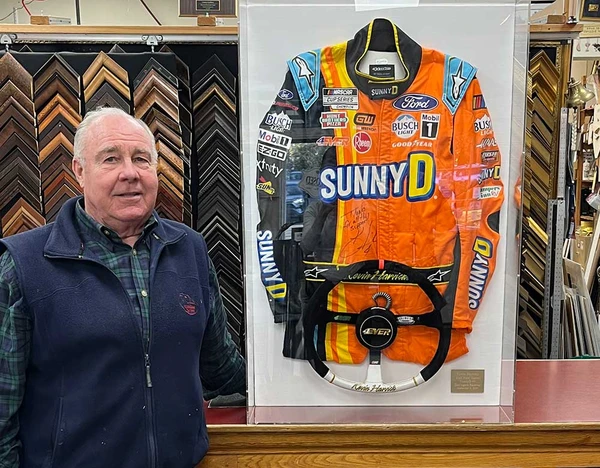 NASCAR driver Kevin Harvick’s fire suit with his steering wheel